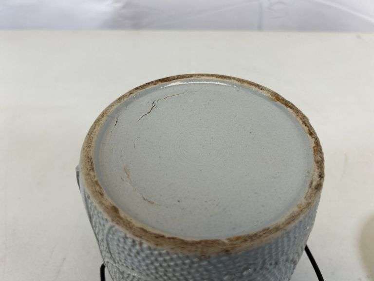 Antique stoneware jar with handle and lid