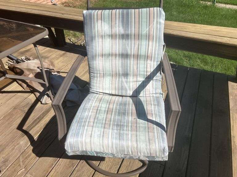 Patio table, chairs, and umbrella