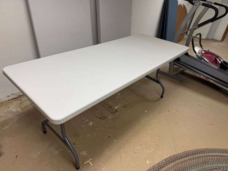 Two plastic folding tables – 6 feet long