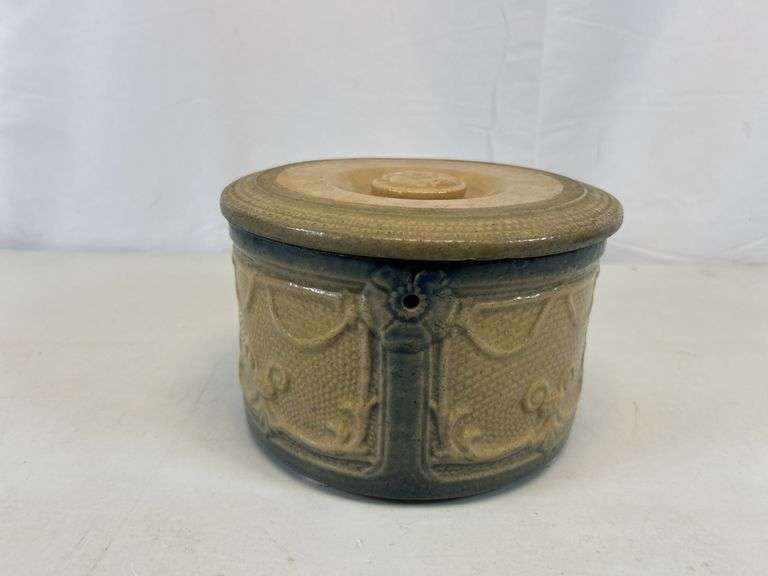 Antique crock with lid