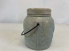 Antique stoneware jar with handle and lid