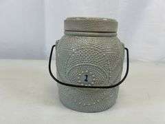 Antique stoneware jar with handle and lid