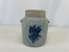 Antique stoneware jar with handle and lid