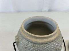 Antique stoneware jar with handle and lid