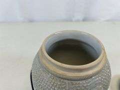 Antique stoneware jar with handle and lid