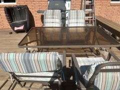 Patio table, chairs, and umbrella