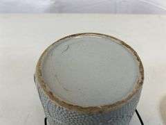 Antique stoneware jar with handle and lid