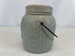 Antique stoneware jar with handle and lid