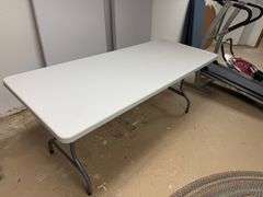 Two plastic folding tables – 6 feet long