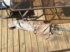 Patio table, chairs, and umbrella