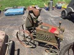 Dog on tractor lawn ornament