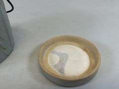 Antique stoneware jar with handle and lid
