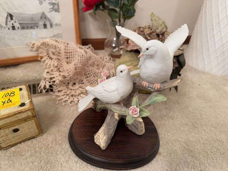 Porcelain white doves, artificial floral arrangements ￼