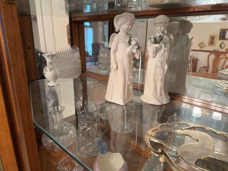 Assortment of crystal serving dishes, porcelain figurines