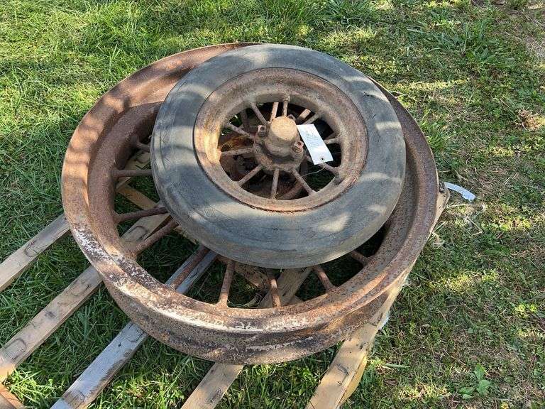 Two John Deere B round spoke rims